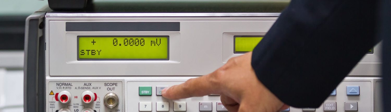 A,Man,Adjust,A,Parameter,Of,Calibrator,Meter,To,Make Electrical Test Calibration